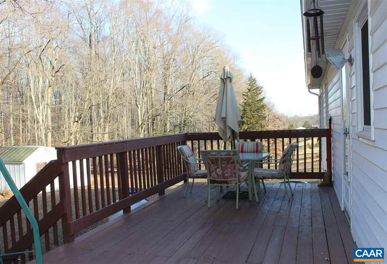 4143 Orange Road Aroda, VA 22709 - Photo 12 of 16 a view of a wooden chairs on deck with wooden floor and fence