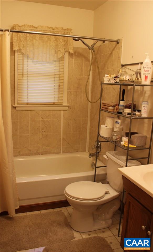 4143 Orange Road Aroda, VA 22709 - Photo 8 of 16 a bathroom with a toilet and a shower