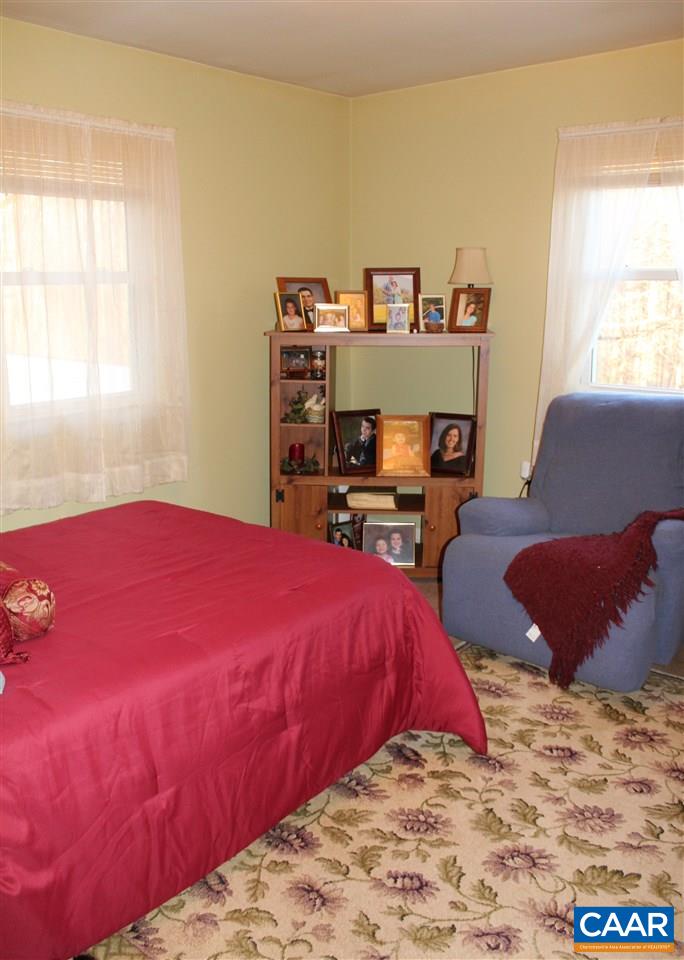 4143 Orange Road Aroda, VA 22709 - Photo 9 of 16 a bedroom with a bed and a couch