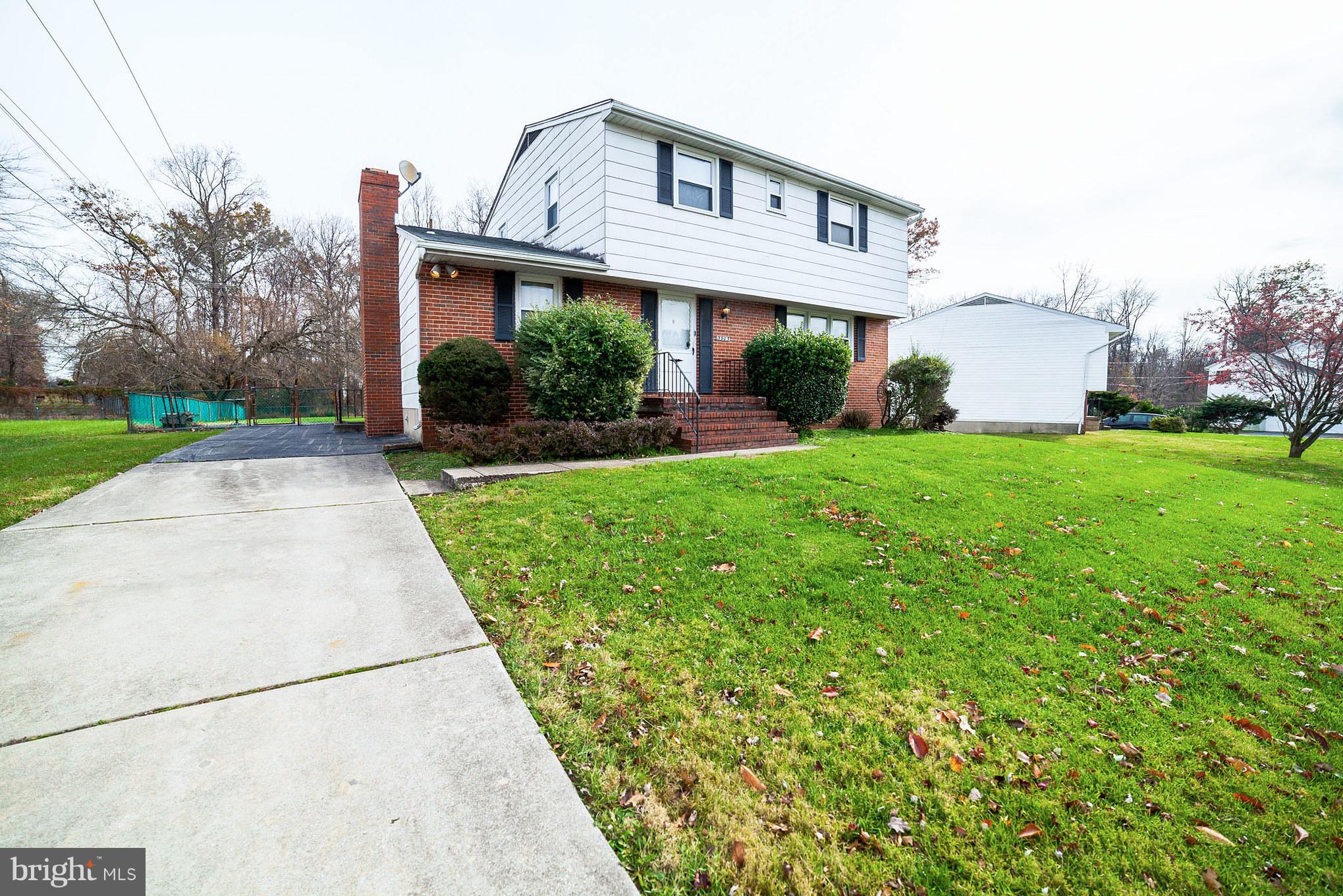 3903 Carthage Road Randallstown, MD 21133 - Photo 2 of 24 a view of a house with a small yard and plants