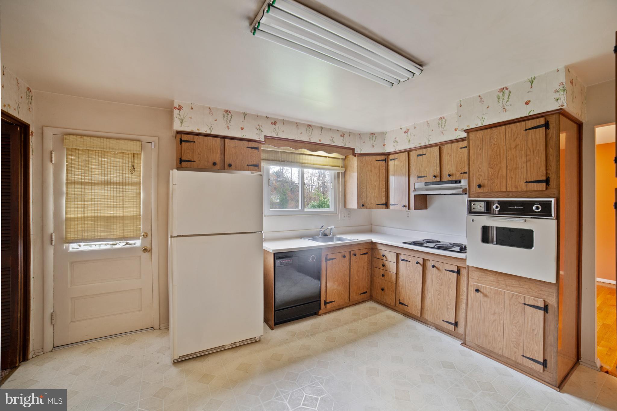 3903 Carthage Road Randallstown, MD 21133 - Photo 12 of 24 a kitchen with stainless steel appliances granite countertop a refrigerator a stove and a sink