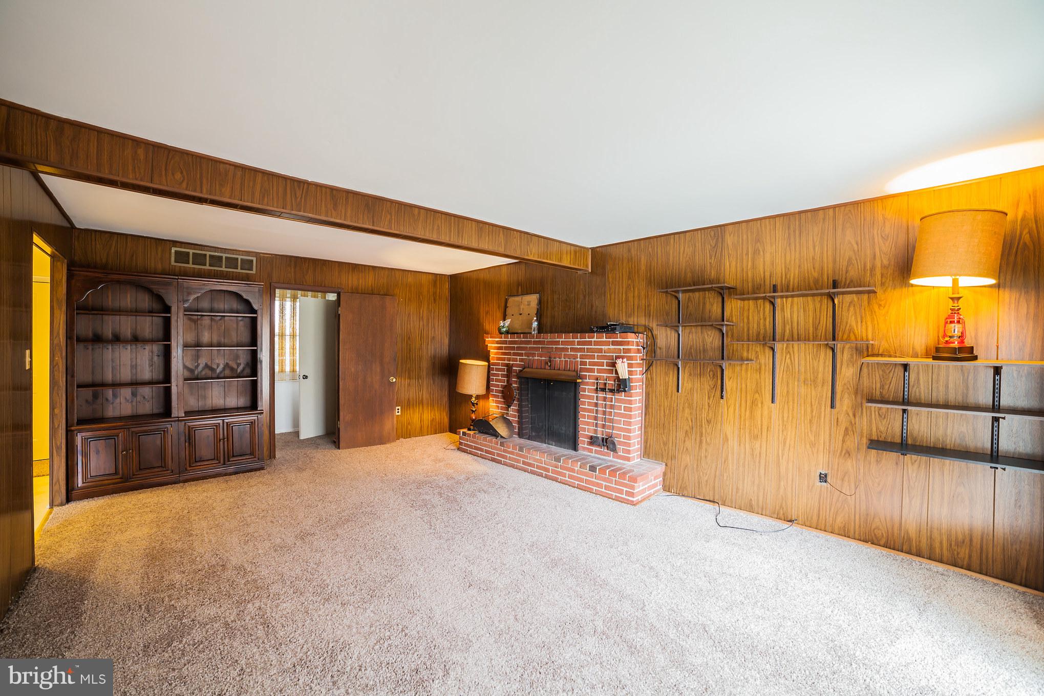 3903 Carthage Road Randallstown, MD 21133 - Photo 13 of 24 an empty room with furniture and fireplace