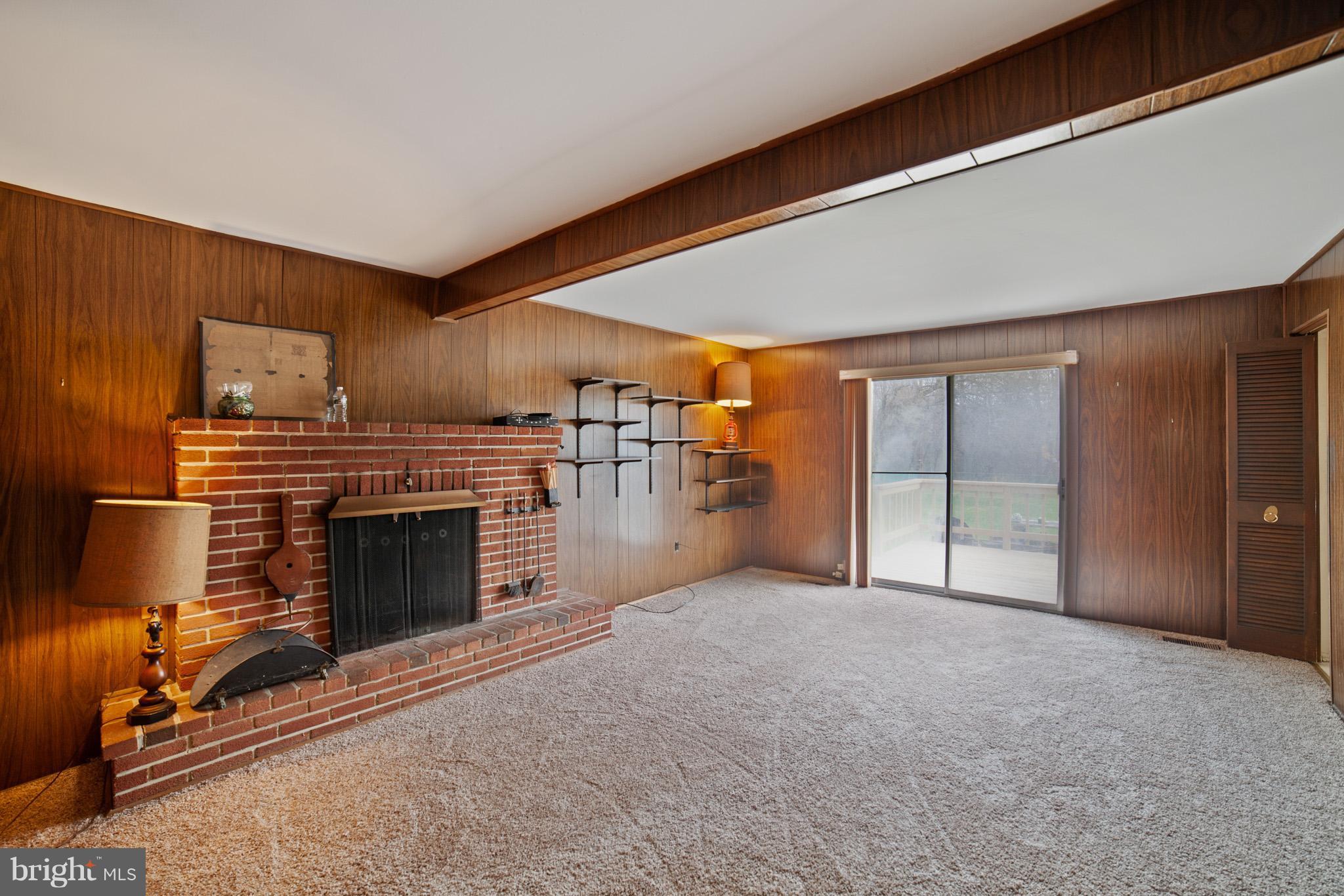 3903 Carthage Road Randallstown, MD 21133 - Photo 14 of 24 a view of an empty room with a fireplace
