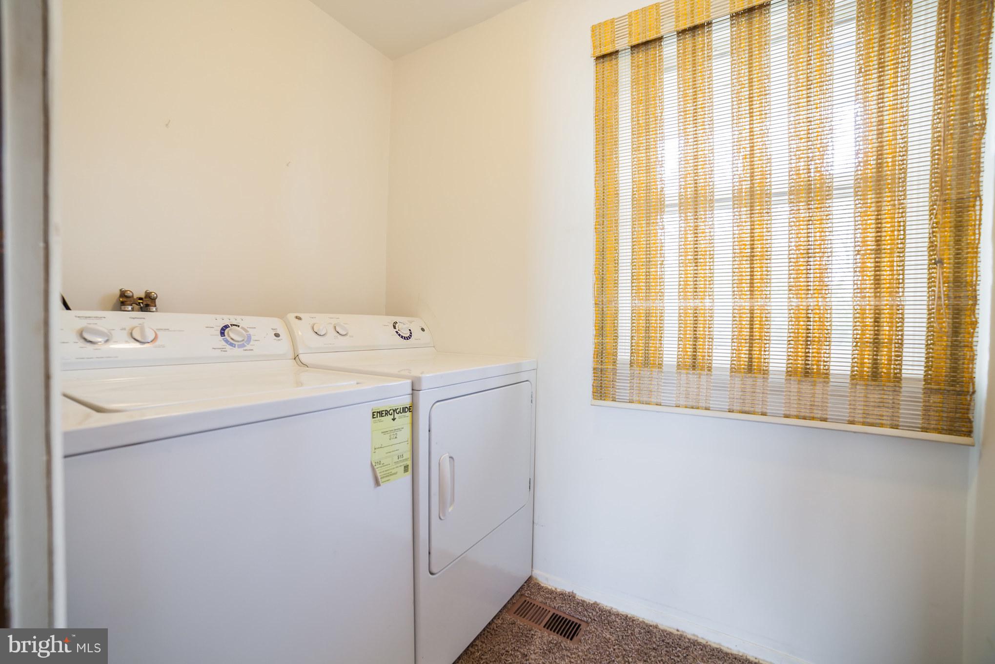 3903 Carthage Road Randallstown, MD 21133 - Photo 17 of 24 a utility room with dryer and washer