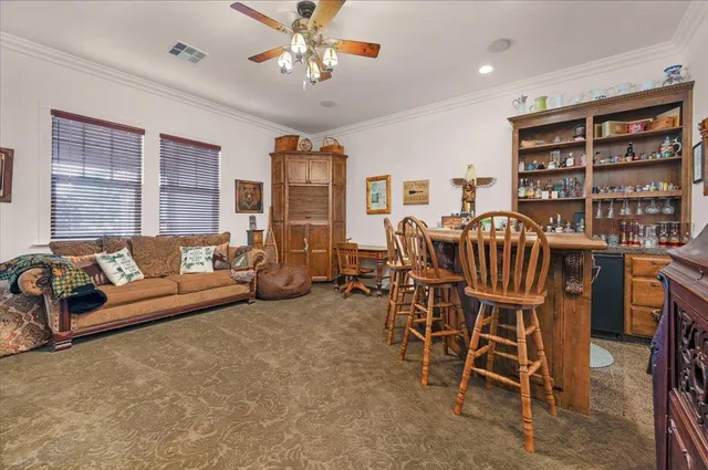 a bedroom with furniture and a window