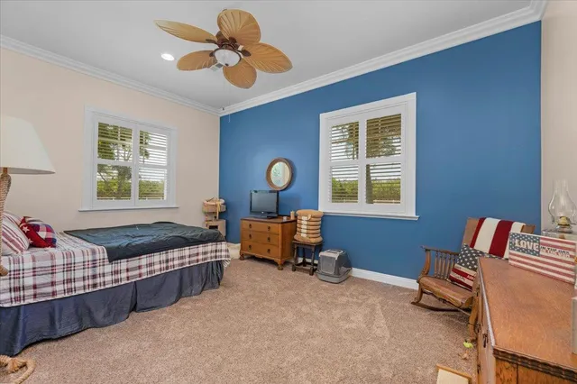 a view of a house with swimming pool and a yard