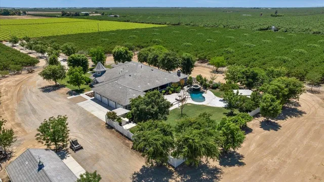 a front view of a house with garden and porch