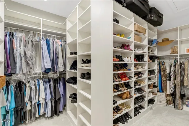 a bathroom with a sink vanity granite shower and a mirror