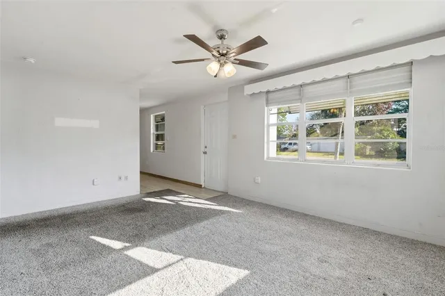 a view of an empty room with a window