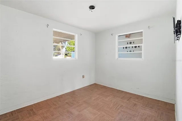 a view of an empty room with a window