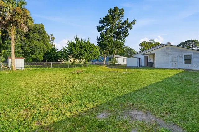 a view of a house with a big yard