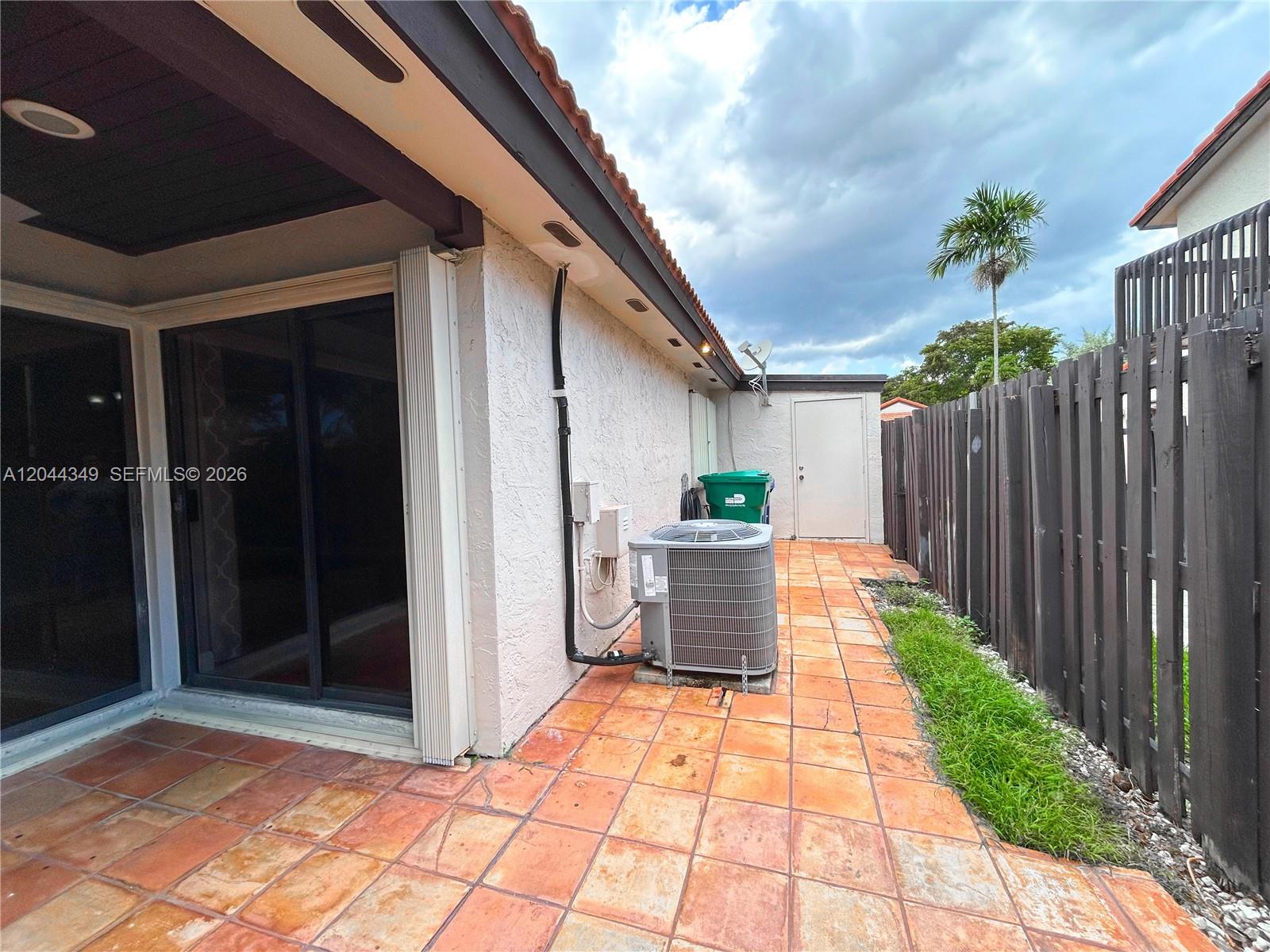 14970 Southwest 48th Terrace, Unit 27G Miami, FL 33185 - Photo 9 of 14 a view of backyard with patio