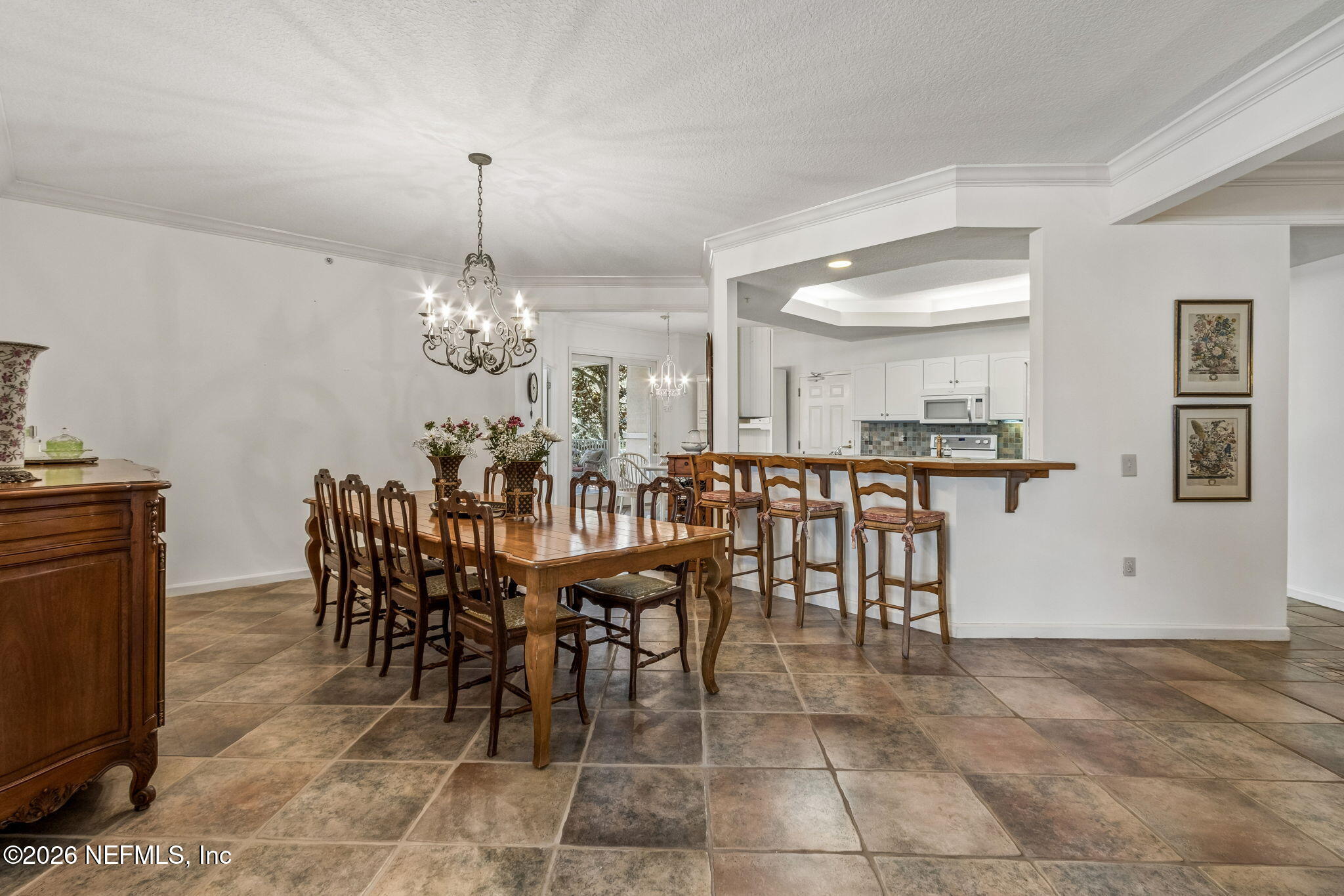 404 Beachside Place Fernandina Beach, FL 32034 - Photo 16 of 96 a view of a dining room with furniture and chandelier