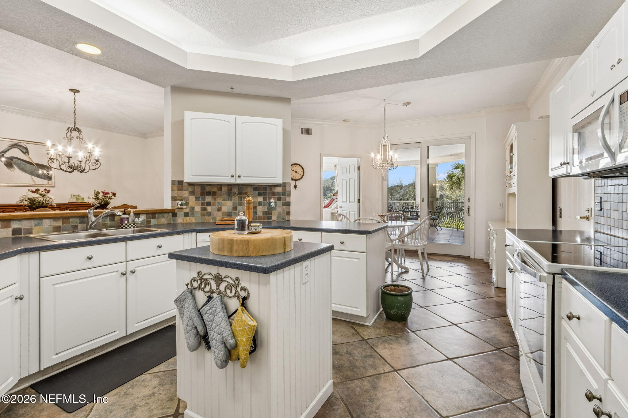 404 Beachside Place Fernandina Beach, FL 32034 - Photo 17 of 96 a kitchen with a sink stove and cabinets