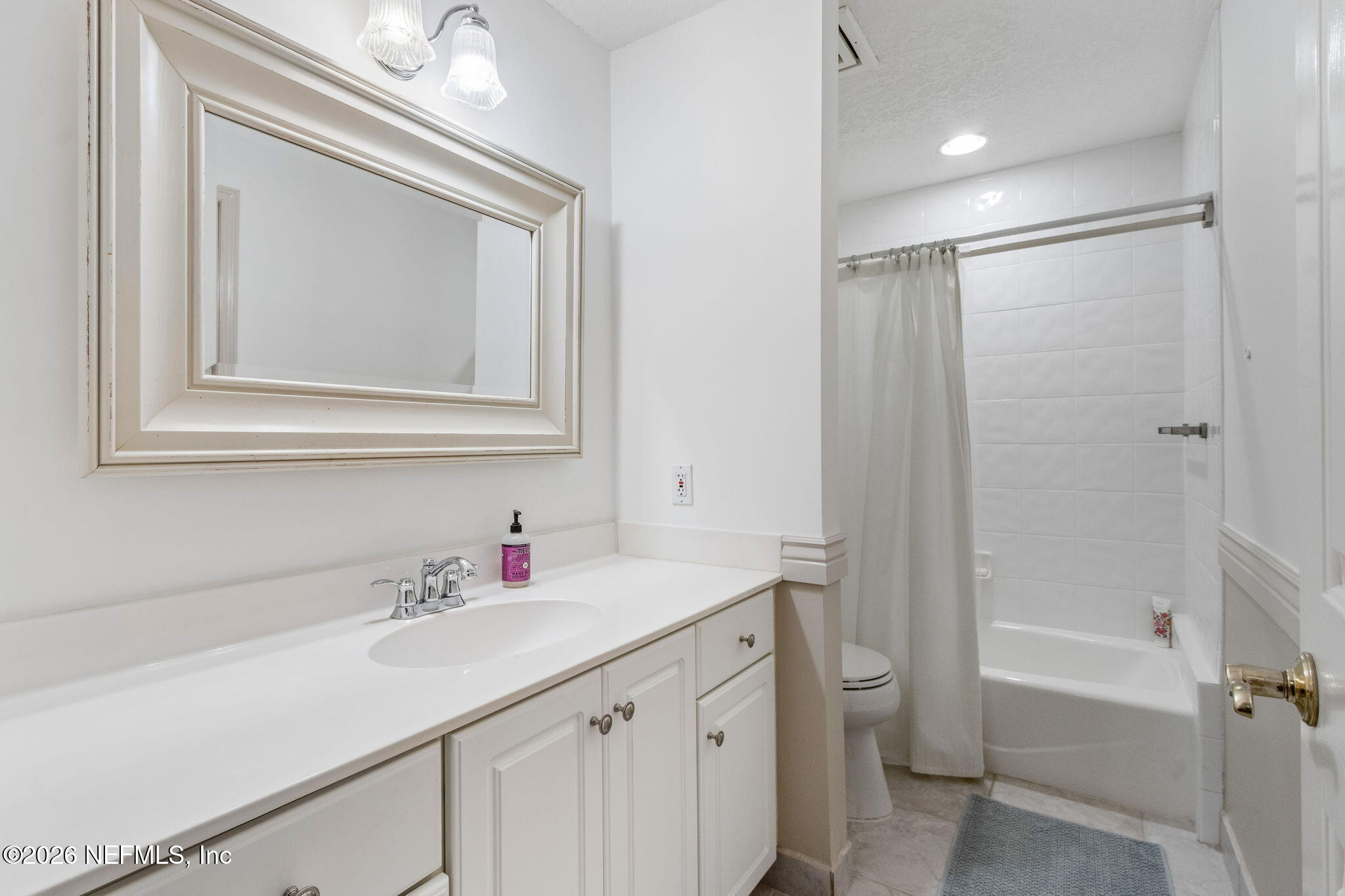 404 Beachside Place Fernandina Beach, FL 32034 - Photo 28 of 96 a bathroom with a sink vanity tub and a mirror