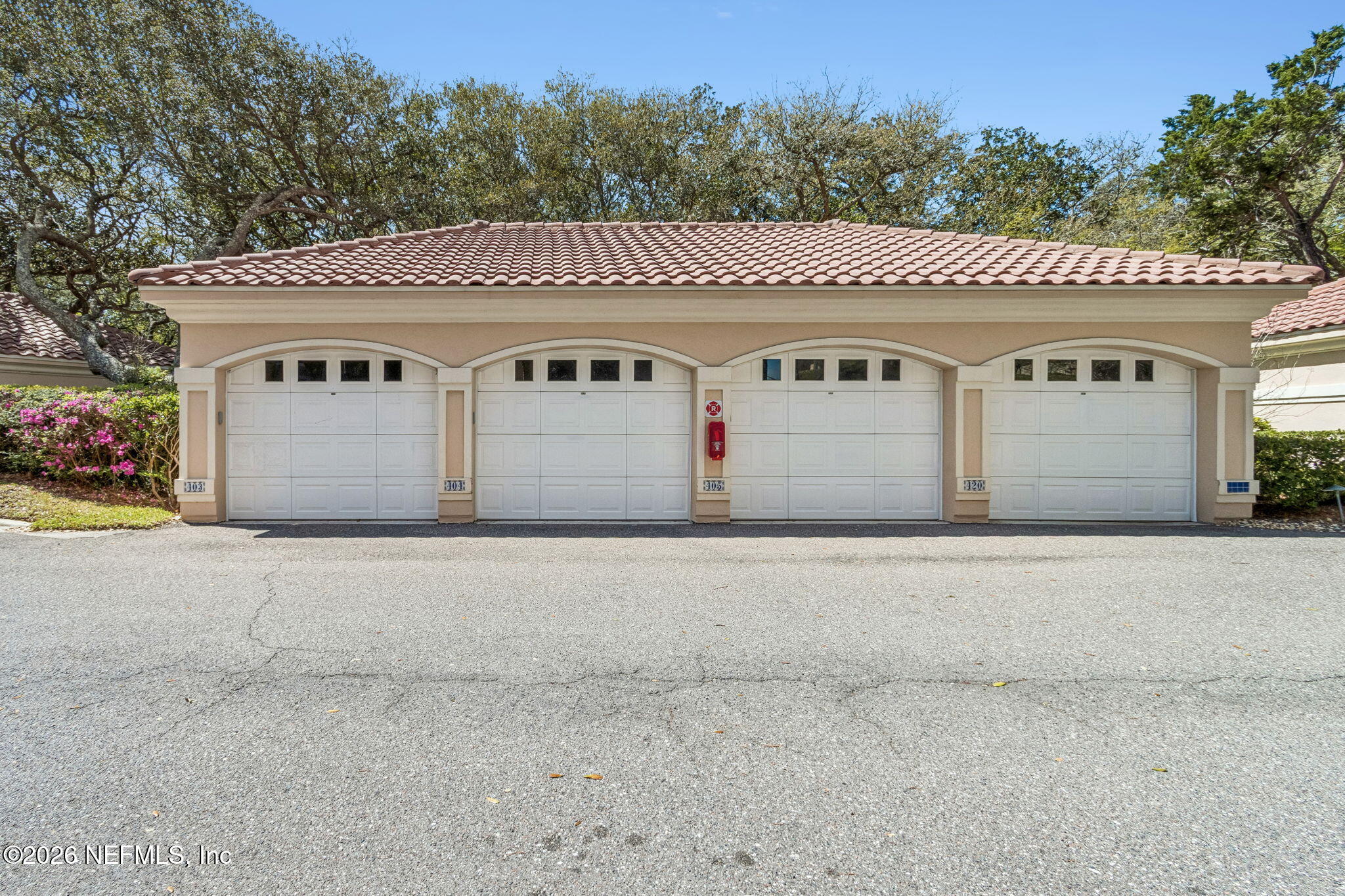 404 Beachside Place Fernandina Beach, FL 32034 - Photo 31 of 96 a front view of a house with a yard and garage