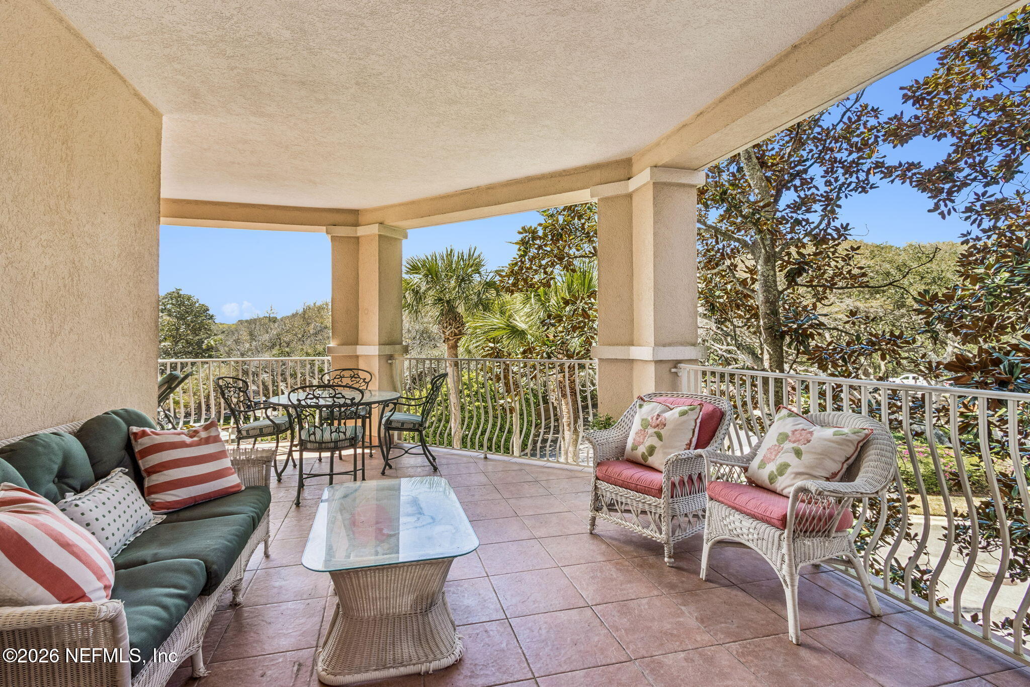 404 Beachside Place Fernandina Beach, FL 32034 - Photo 8 of 96 a living room with furniture and a floor to ceiling window