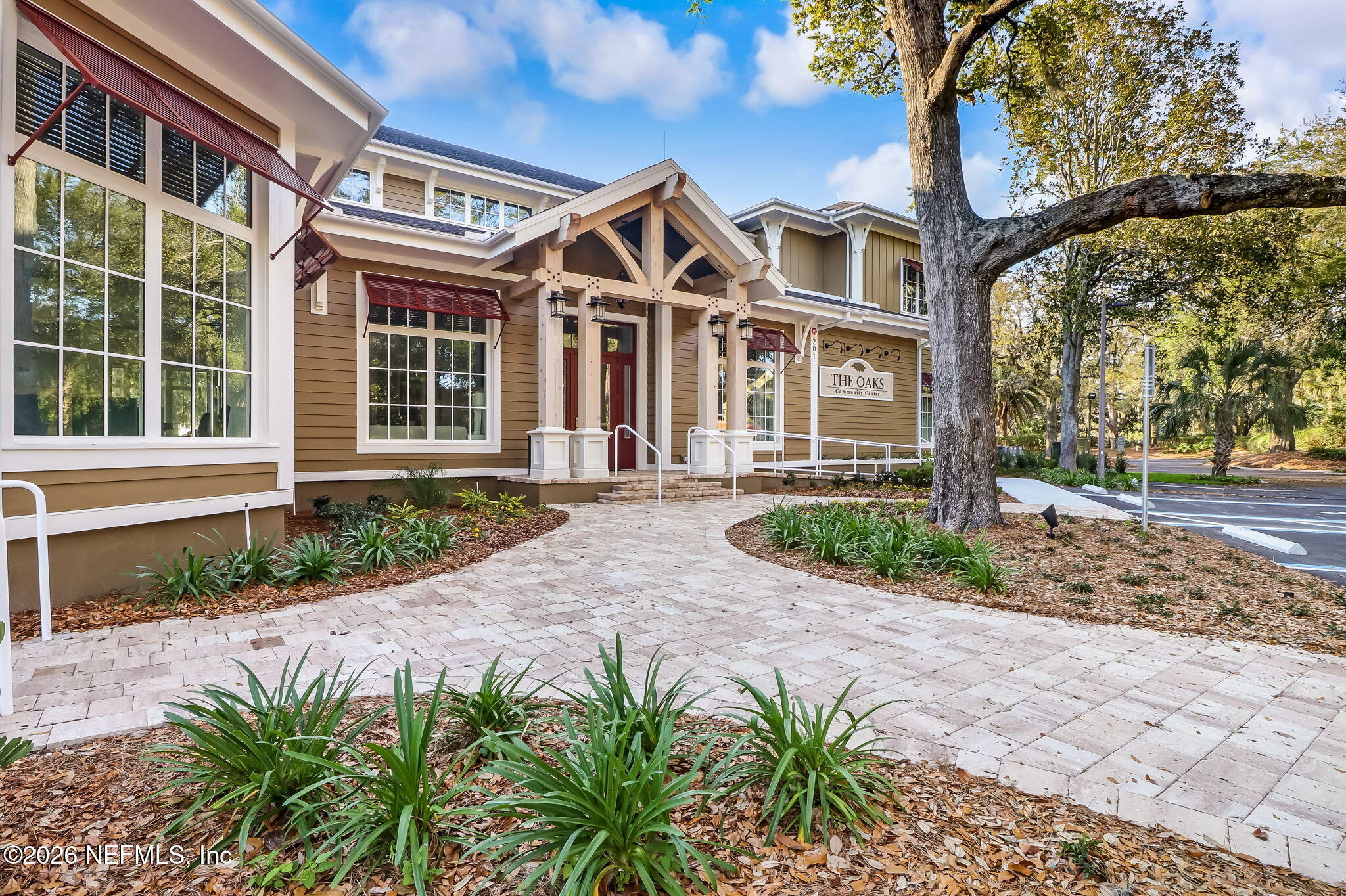 404 Beachside Place Fernandina Beach, FL 32034 - Photo 86 of 96 a front view of a house with a garden