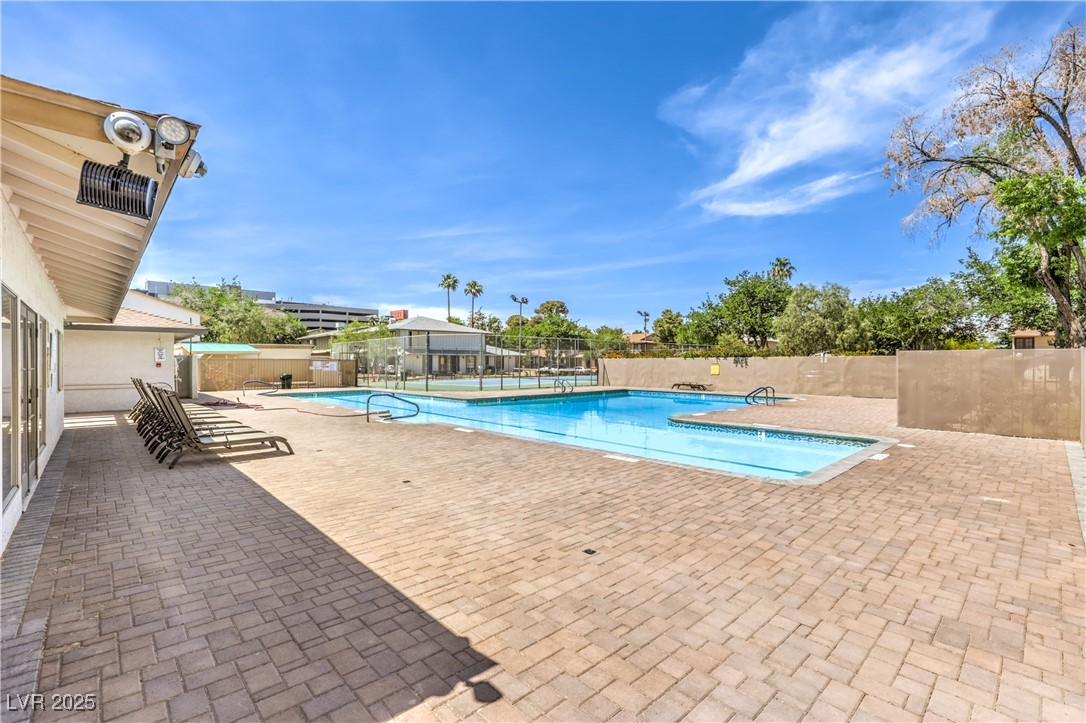 1553 Dorothy Avenue, Unit 4 Las Vegas, NV 89119 - Photo 24 of 36 Community pool with a patio area