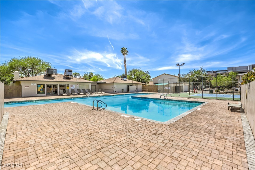 1553 Dorothy Avenue, Unit 4 Las Vegas, NV 89119 - Photo 25 of 36 Community pool with a patio