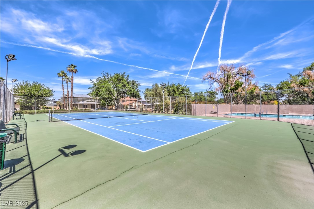 1553 Dorothy Avenue, Unit 4 Las Vegas, NV 89119 - Photo 27 of 36 View of tennis court with community basketball court