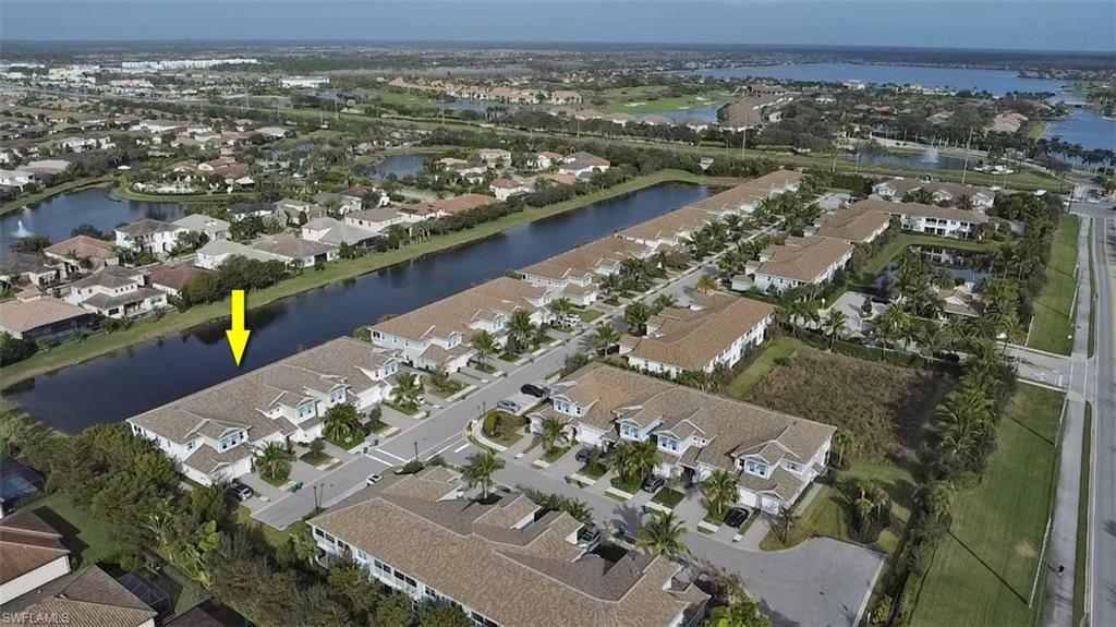 2295 Sawyers Hill Road, Unit 1002 Naples, FL 34120 - Photo 29 of 41 an aerial view of a city
