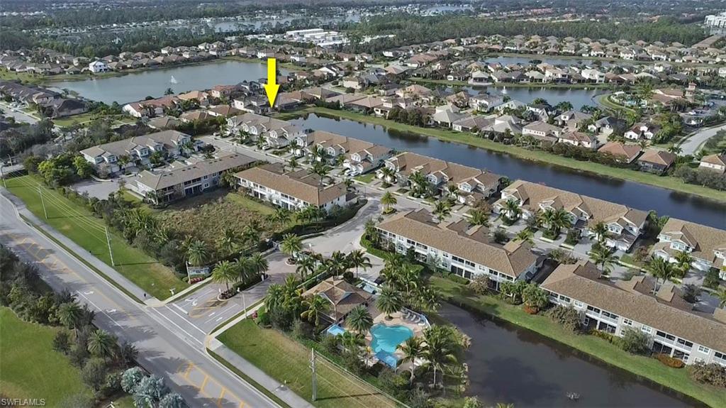 2295 Sawyers Hill Road, Unit 1002 Naples, FL 34120 - Photo 33 of 41 an aerial view of lake
