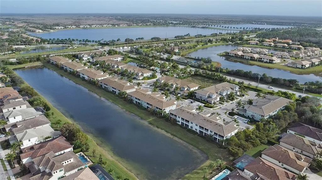 2295 Sawyers Hill Road, Unit 1002 Naples, FL 34120 - Photo 34 of 41 an aerial view of residential houses with outdoor space