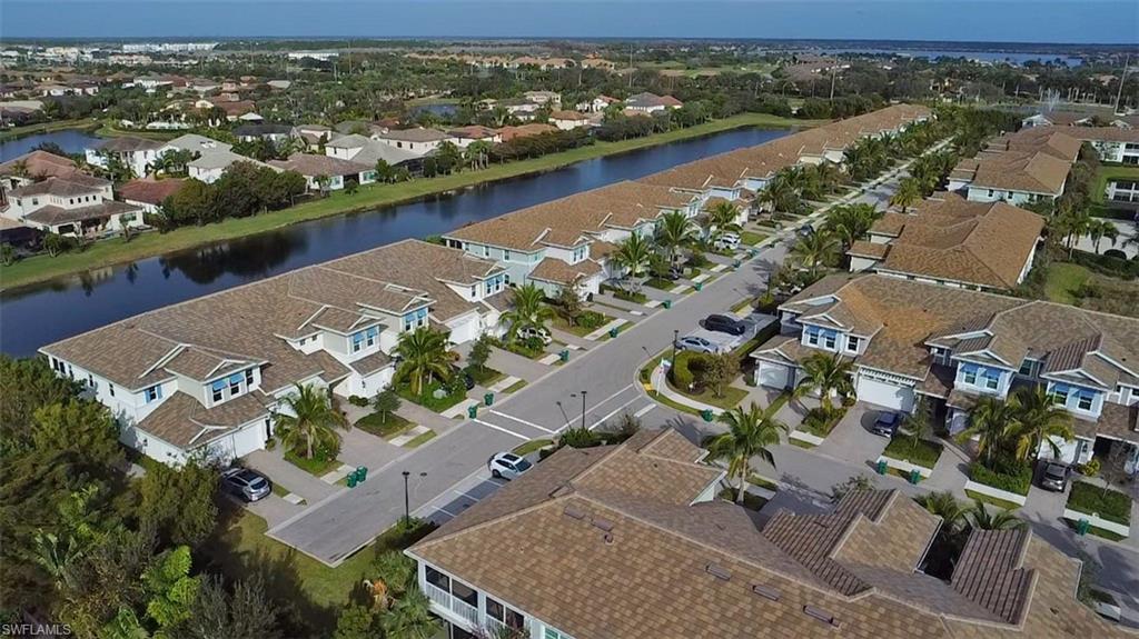 2295 Sawyers Hill Road, Unit 1002 Naples, FL 34120 - Photo 38 of 41 an aerial view of a city with lake view