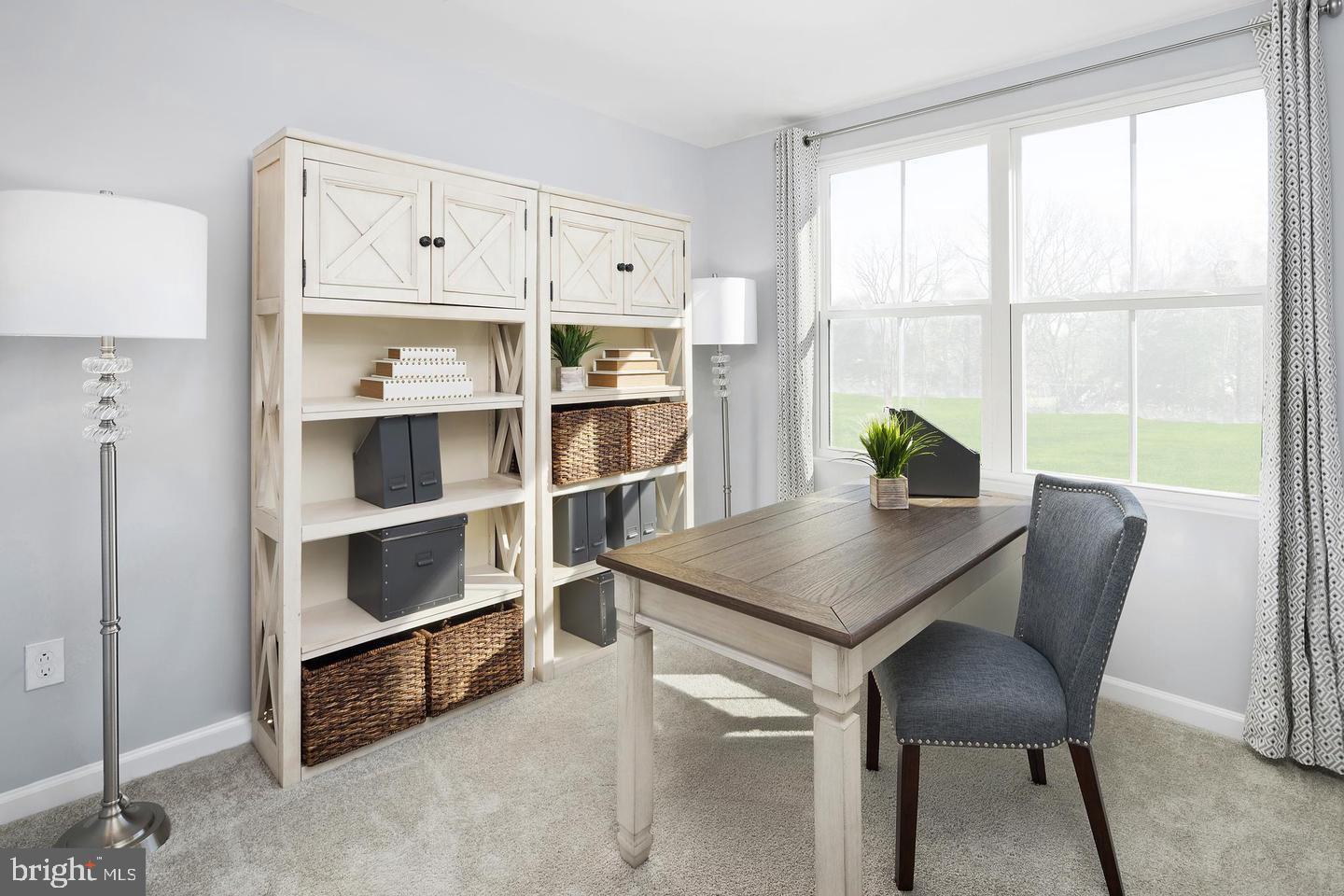 601 Yellow Bill Lane, Unit JUNIPER Cambridge, MD 21613 - Photo 12 of 14 a view of a workspace with furniture and a window