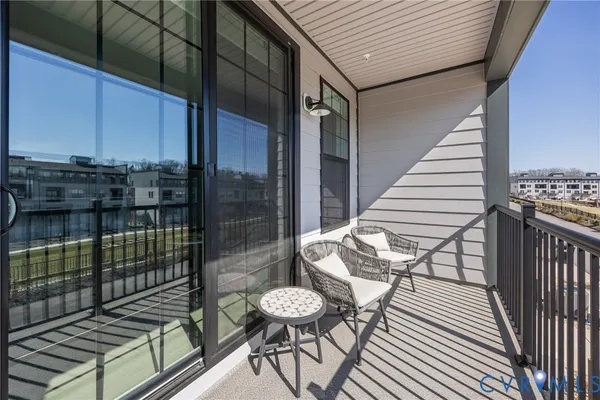 a view of a balcony with chairs
