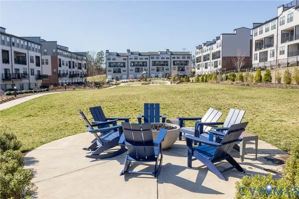 a view of a swimming pool with outdoor seating