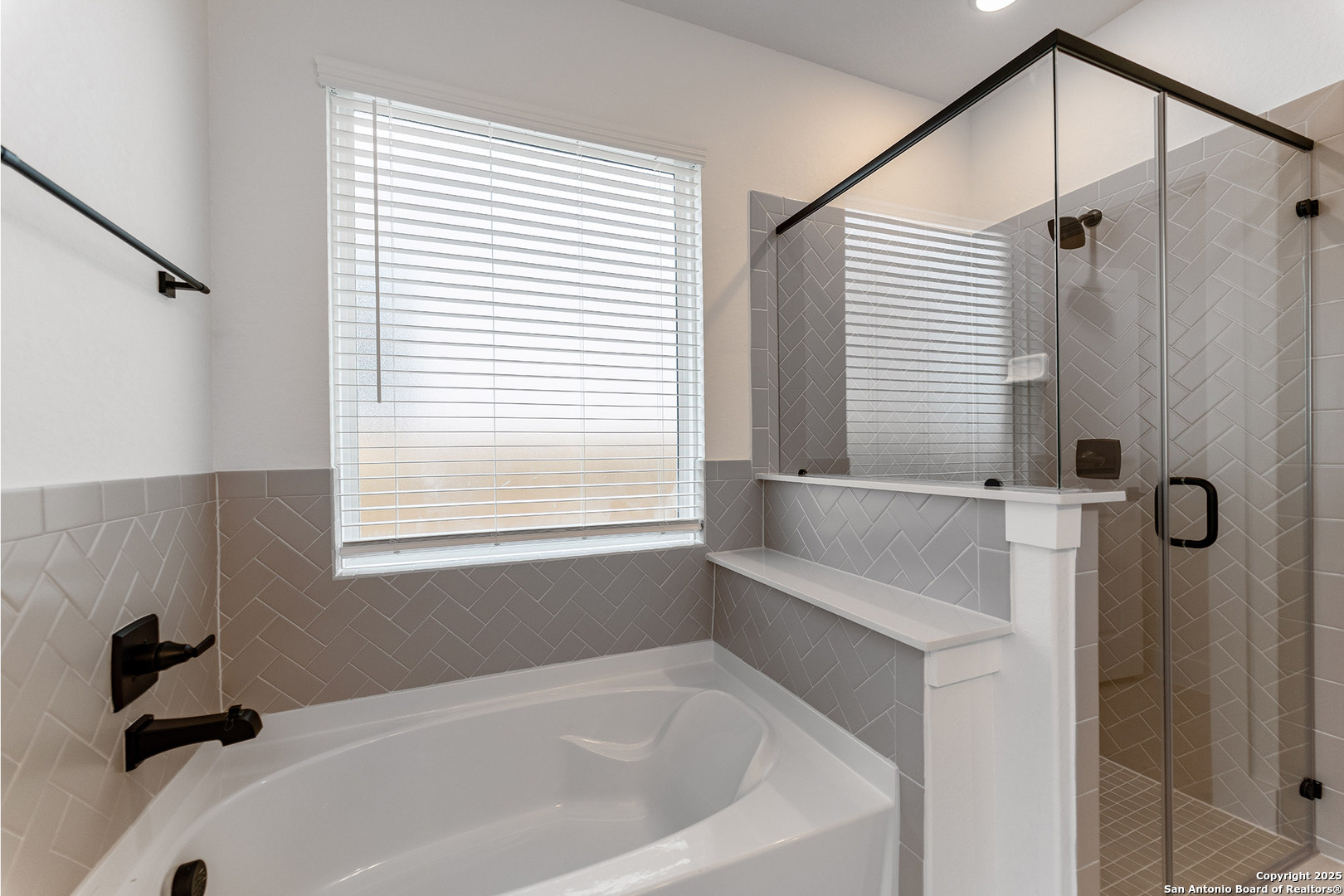 182 Ednie Lane Mico, TX 78056 - Photo 14 of 19 a bathroom with a bathtub and shower