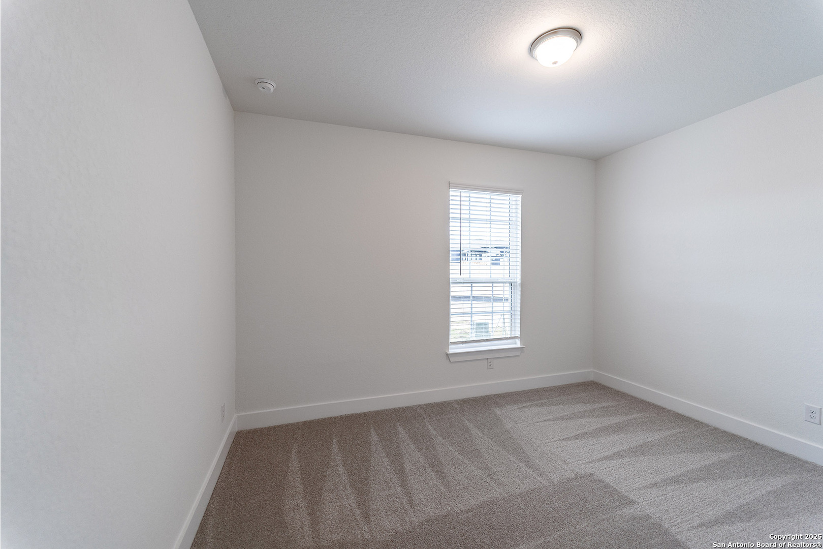 182 Ednie Lane Mico, TX 78056 - Photo 16 of 19 an empty room with a window