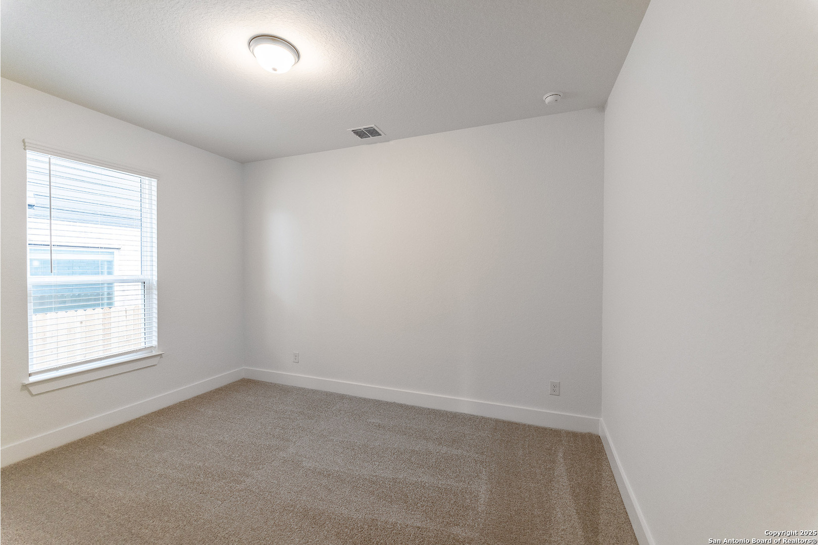 182 Ednie Lane Mico, TX 78056 - Photo 17 of 19 an empty room with a window