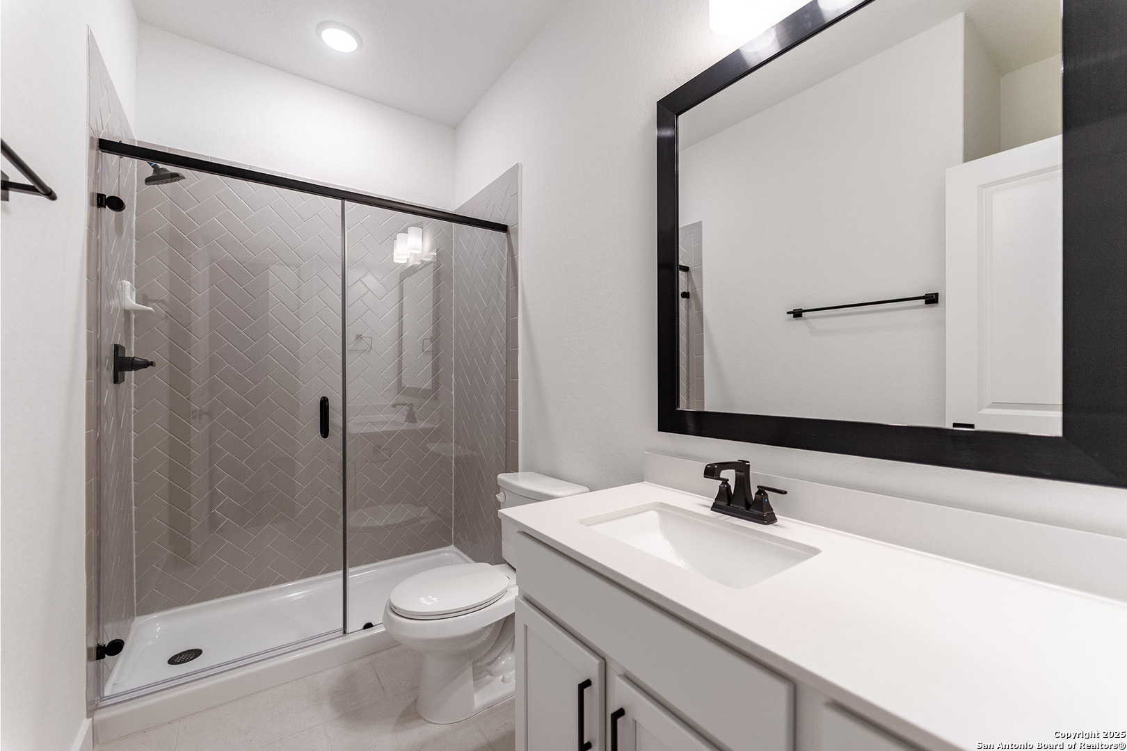 182 Ednie Lane Mico, TX 78056 - Photo 18 of 19 a bathroom with a sink a toilet and shower