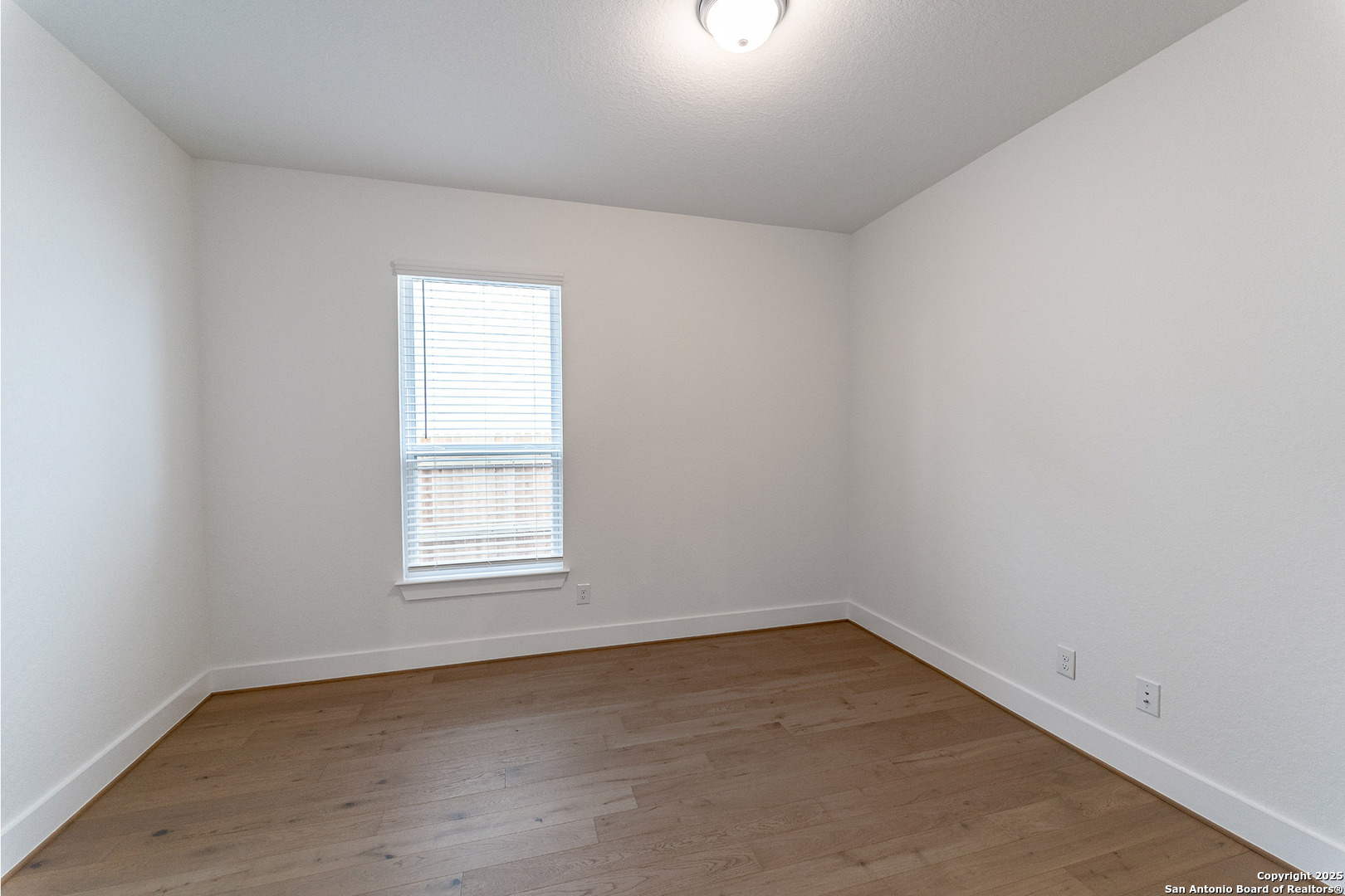 182 Ednie Lane Mico, TX 78056 - Photo 4 of 19 an empty room with a window