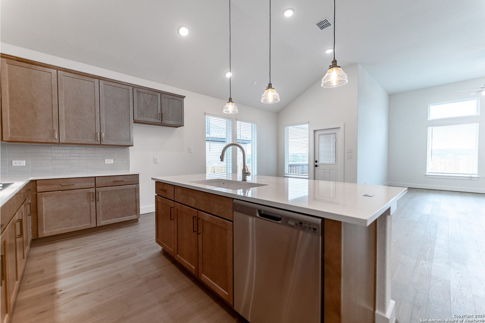 182 Ednie Lane Mico, TX 78056 - Photo 8 of 19 a kitchen with a sink a counter space appliances and cabinets