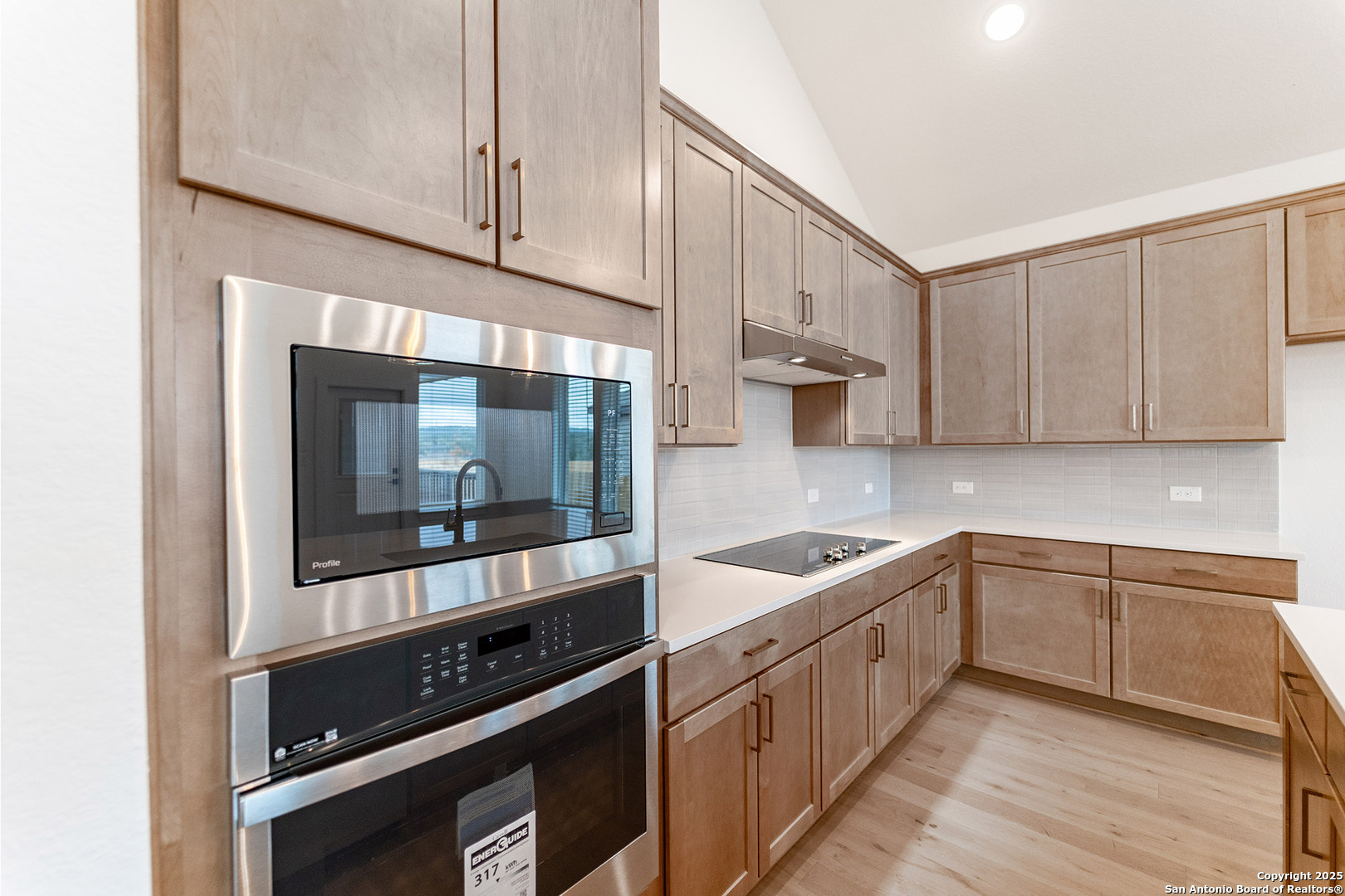 182 Ednie Lane Mico, TX 78056 - Photo 10 of 19 a kitchen with stainless steel appliances a sink stove and cabinets