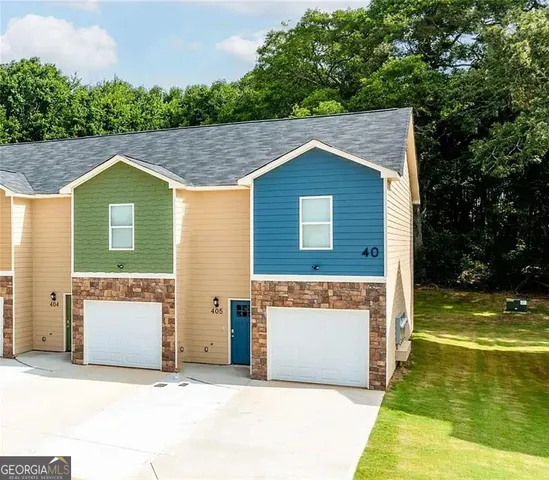 a aerial view of a house with a yard
