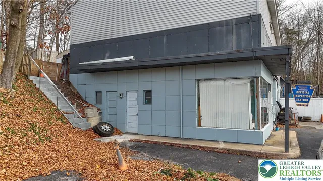 a view of a street with stores