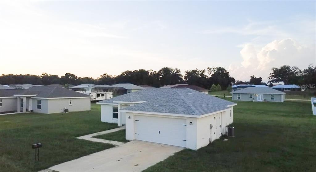 4381 East Ravenna Street Inverness, FL 34453 - Photo 3 of 44 a view of a house with a outdoor space