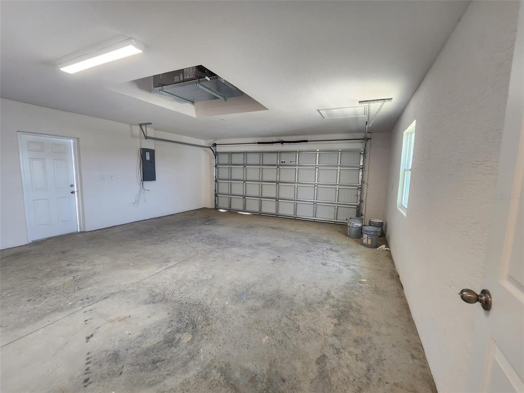 4381 East Ravenna Street Inverness, FL 34453 - Photo 37 of 44 an empty room with a empty space and windows