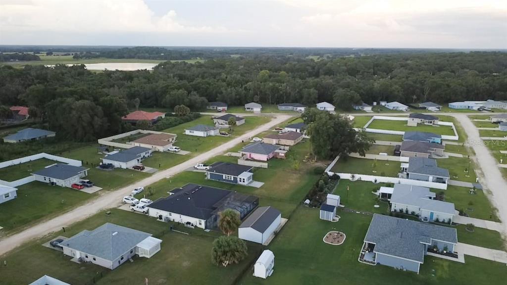 4381 East Ravenna Street Inverness, FL 34453 - Photo 41 of 44 an aerial view of a house with a garden