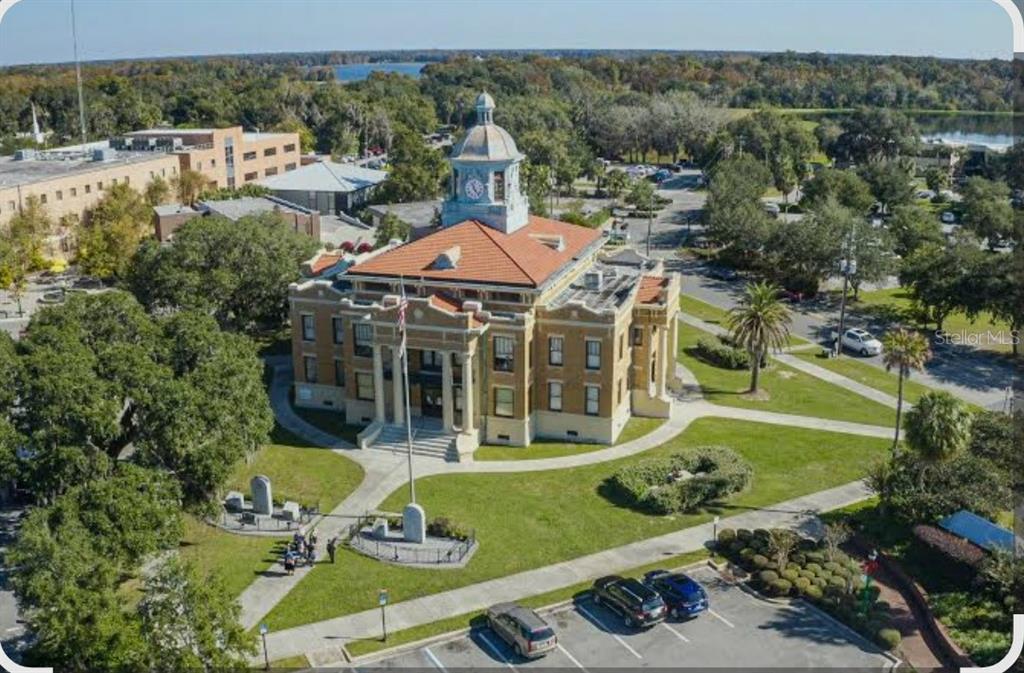 4381 East Ravenna Street Inverness, FL 34453 - Photo 43 of 44 an aerial view of a house with swimming pool patio and mountain view