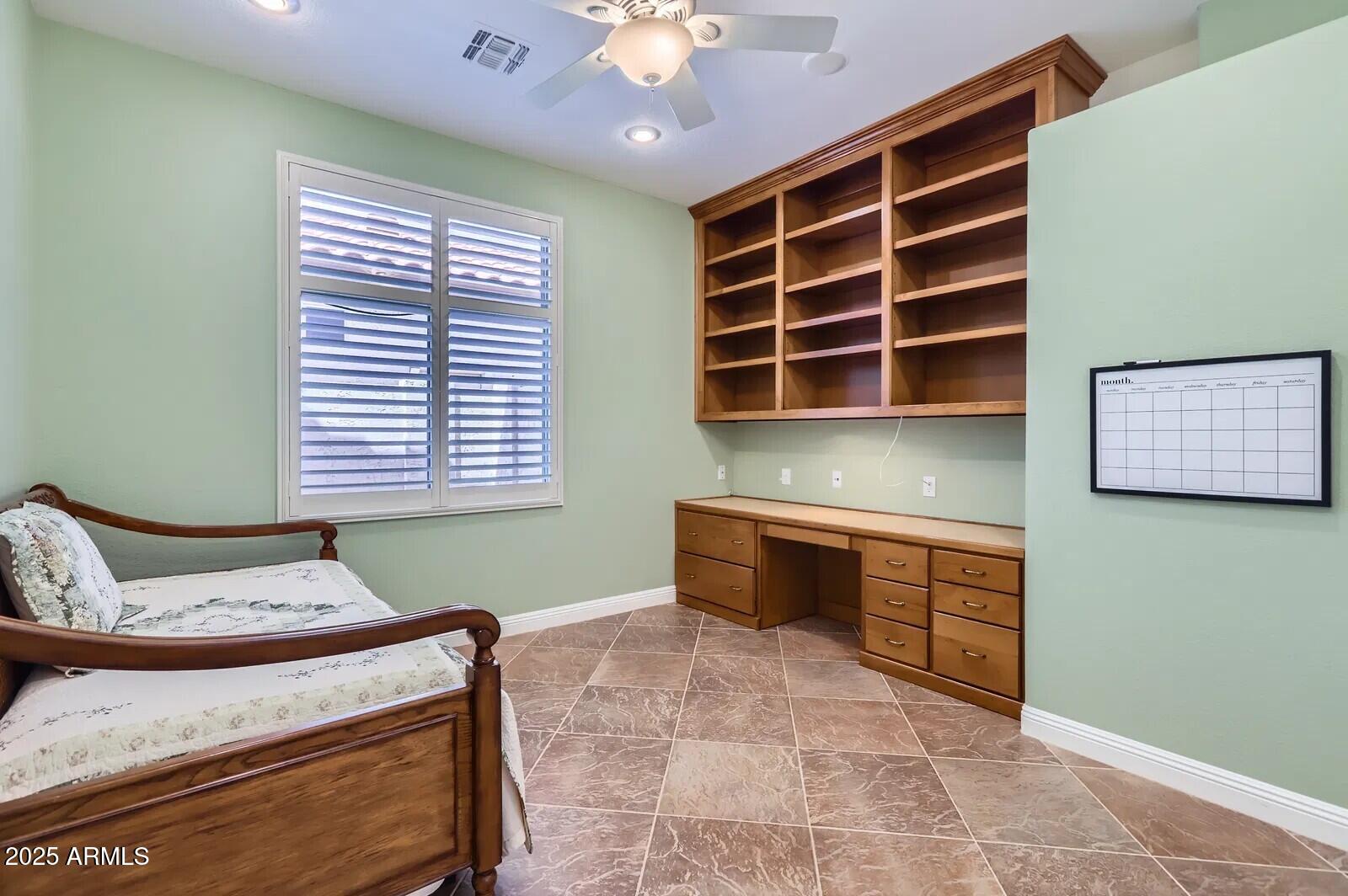17951 West Sammy Way Surprise, AZ 85374 - Photo 13 of 24 a bedroom with a bed and a window