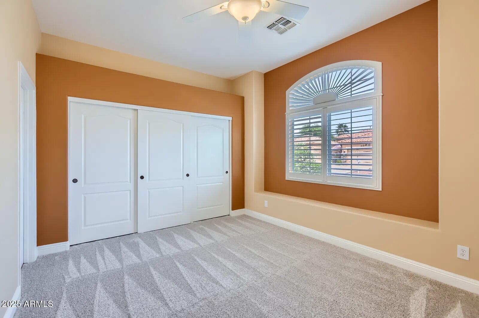 17951 West Sammy Way Surprise, AZ 85374 - Photo 18 of 24 a view of an empty room with a window and a bathroom
