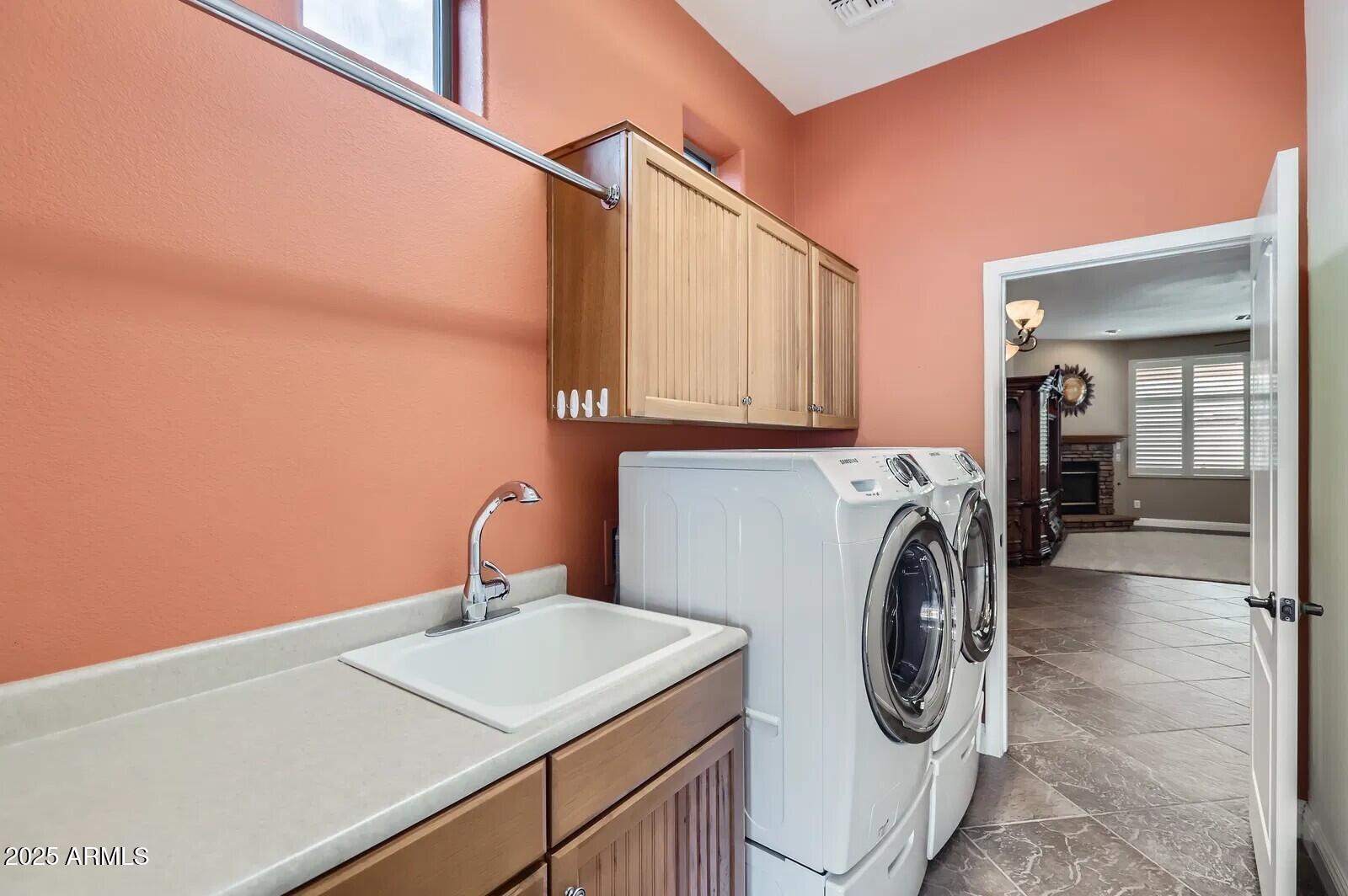 17951 West Sammy Way Surprise, AZ 85374 - Photo 23 of 24 a utility room with dryer and washer
