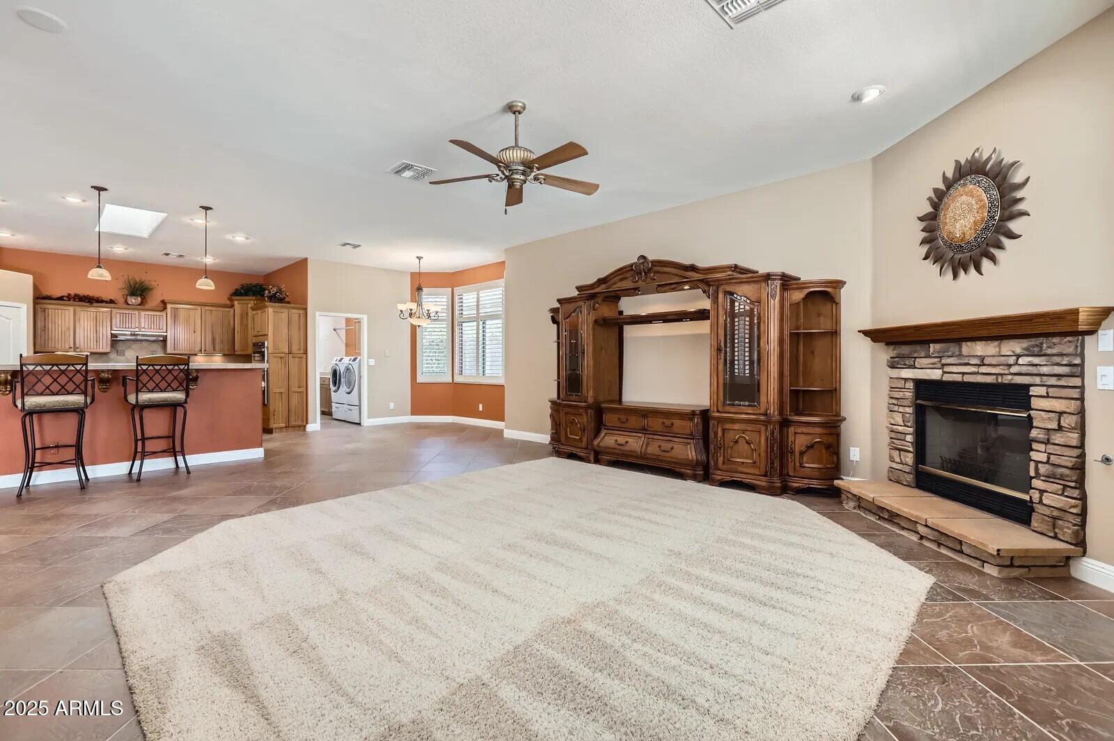 17951 West Sammy Way Surprise, AZ 85374 - Photo 6 of 24 a view of a livingroom with furniture and a fireplace