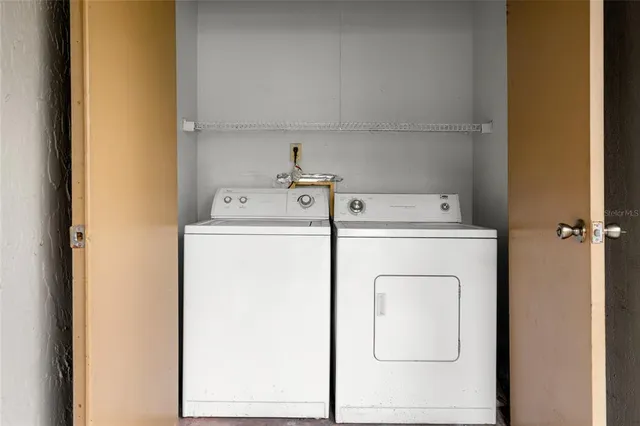 a utility room with dryer and washer